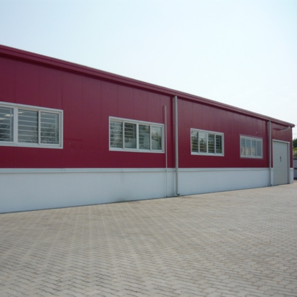 Edificio de almacén industrial de estructura de acero con marco de portal prefabricado Q355 galvanizado en caliente de gran envergadura